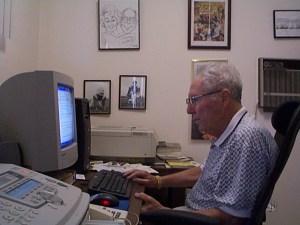 Glasser writing at home. (Photo by Jim Roy)