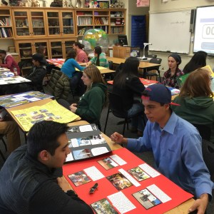 The classroom abuzz with students talking presenting their cultural heritage projects to each other.